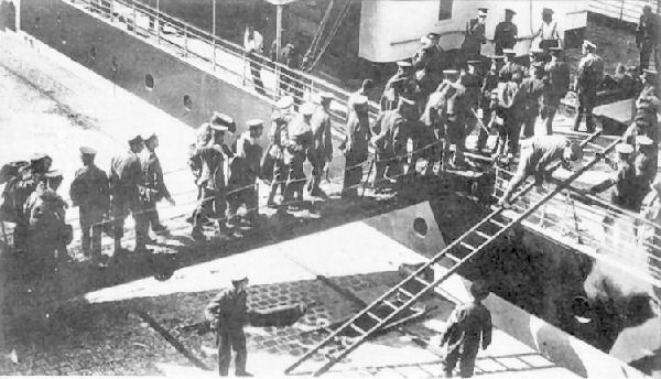 A hospital ship at Le Havre with wounded soldiers boarding